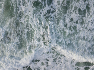 Aerial photo of a small surf break off the coast of New Zealand. 