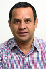 Fototapeta premium Portrait of overweight Indian businessman against white background