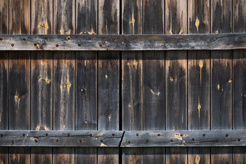 background of old wooden gate with knots