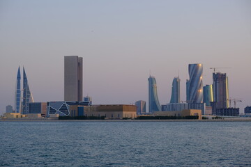 Bahrain city skyline captured during summer golden hour.