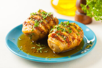 Baked potatoes in Swedish. Hasselback. Stuffed with cheese and bacon. Top view.