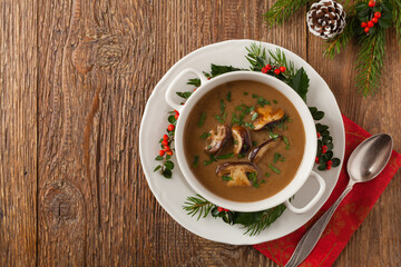 Traditional mushroom soup, made from porcini mushrooms. Christmas decoration.