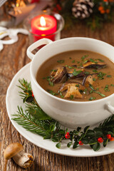 Traditional mushroom soup, made from porcini mushrooms. Christmas decoration.