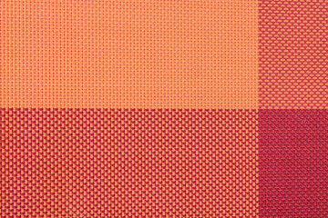orange and red plastic tablecloth texture top view