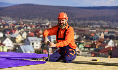 Safety is main point. Roofer working tool. Construction Industry and Waterproofing. roofer working...