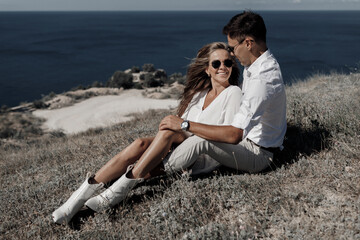 lifestyle engagement photo session young man and woman near yachts, couple in the city