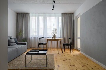 Simple living room with exposed concrete
