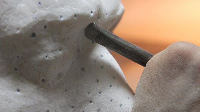 Sculptor Carving On Marble. Working with stone and sculpting statue