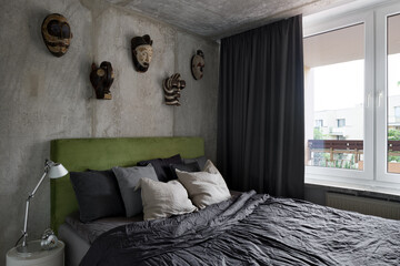 Bright bedroom with exposed concrete