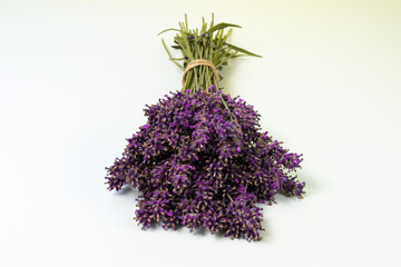Stack of violet lavender on a white pale background front view