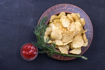 Potato Chips on an old wooden table. Close up food photo