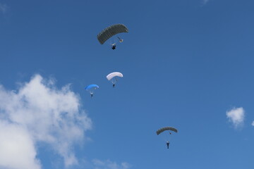 paratrooper parachutist soliders landing at parade ceremony
