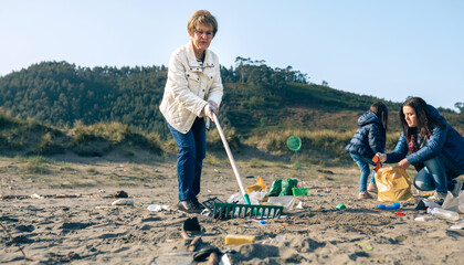 Group of female volunteers cleaning the beach