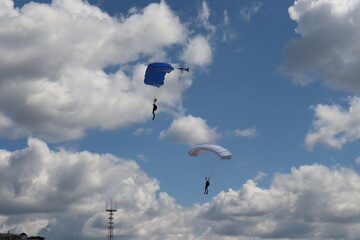 paratrooper parachutist soliders landing at parade ceremony