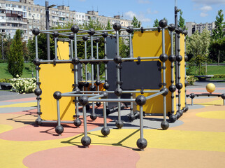 Children's sports playground in the city square. Sports equipment for children and adults in the form of a set of cubes