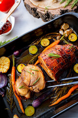 Lecere roll roast with vegetables and herbs.