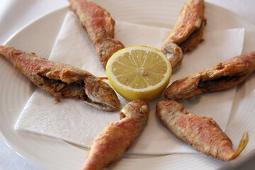 Fried fish plate with lemon