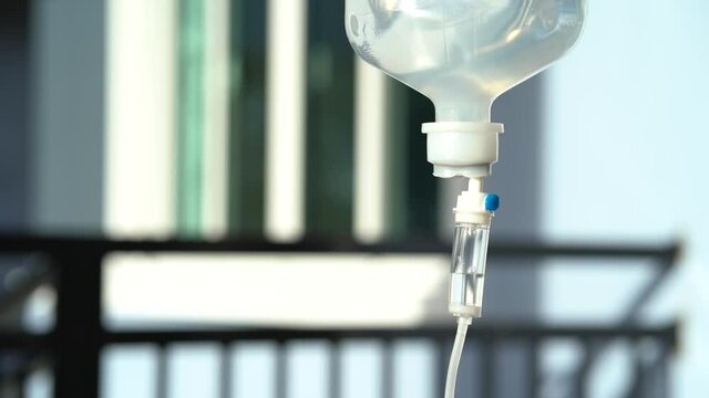 Closeup of IV drip 60 cc/hr. in hospital, Intravenous saline solution, IV loading. 