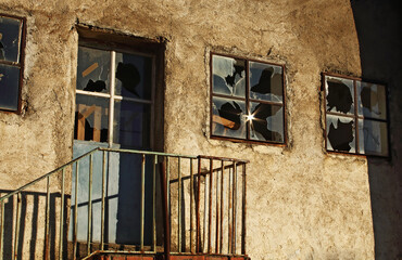 Broken glass windows in old abandoned building