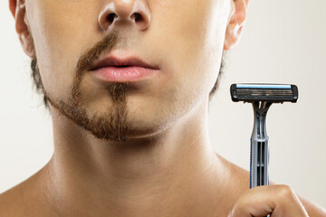 Male  face with a partially shaved beard