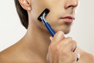 Man during shaving routine with a safety razor