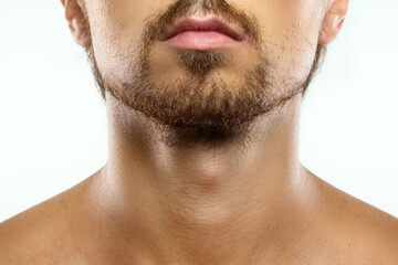 Unshaved man with a unkempt beard