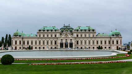 Fototapeta na wymiar Vienna, Austria - August 04, 2020: Beautiful panoramic view of the upper Belvedere Palace in Vienna from the side of the park during the day, Austria