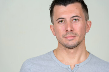 Fototapeta premium Portrait of young handsome man with beard stubble