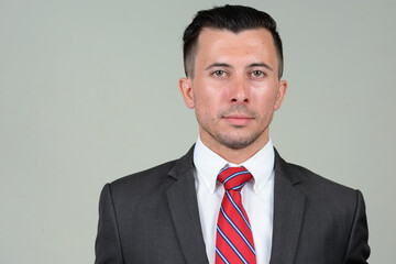 Portrait of young handsome businessman in suit
