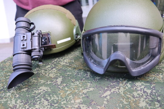 military green helmet with optical sight