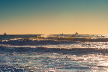 Cargo ship with containers in sunrise light