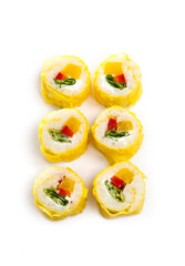 yellow maki sushi rolls isolated on white background