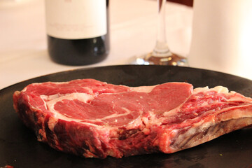 Raw beef steak on a plate
