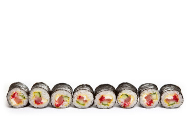 yellow maki sushi rolls isolated on white background