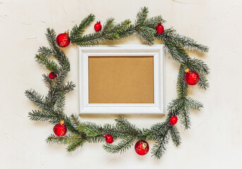 Fototapeta na wymiar Christmas light background, fir branches wreath with red baubles and berries, beautiful frame and copy space for your text. White creative layout, flat lay, top view.