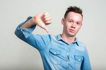 Portrait of young man against white background