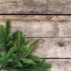 Christmas background, old wood texture, festive corner decorate. Pine fir leaf, twigs. Xmas, New Year wallpaper, greeting card, top view flat lay.