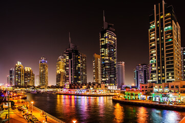 DUBAI, UAE - MARCH 21: Dubai Marina at dusk March 21, 2016, Dubai, UAE. In the city of artificial channel length of 3 kilometers along the Persian Gulf.