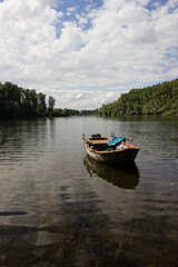 Naklejka na ściany i meble Wooden boat on a river in germany