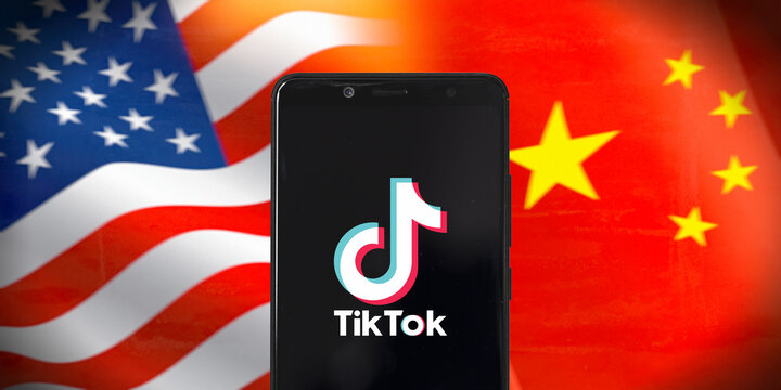 Smart phone with TIK TOK logo on National flags of the United States and China