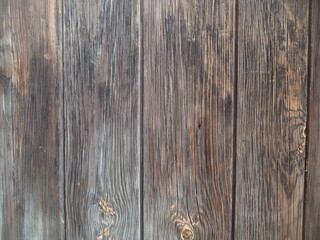 The dark background of vertical planks. Background for websites. Wooden structure, pattern. 