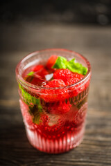 Old fashioned raspberry cocktail. Selective focus. Shallow depth of field.