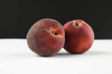 hairy peaches on a white and black background