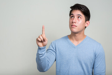 Fototapeta premium Portrait of young handsome man with mixed race