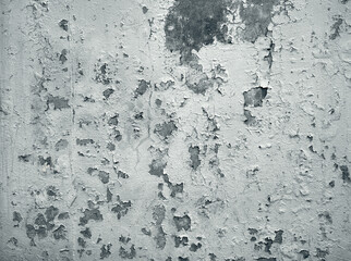 Old cracked paint on the concrete wall.