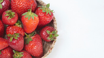 ripe red strawberries close up on a white background