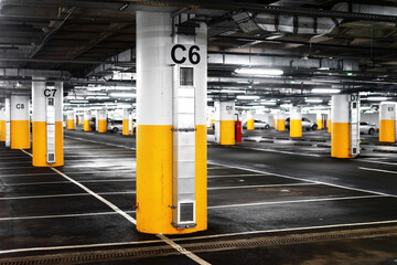 Underground parking for a mall or condominium. Without people and cars during the COVID-19 epidemic.