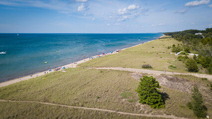 view of the beach on Lake Michigan showing the beach and lake as far as the eye can see