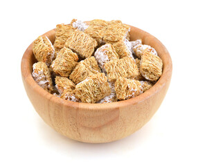 Breakfast setting with frosted wheat cereal in wood bowl