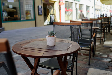 Empty tables in street summer terrace cafe